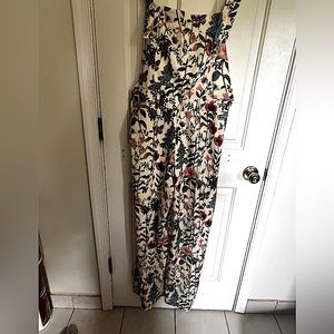 Ladybug overalls size XL has a zipper on the side for easy in and out.